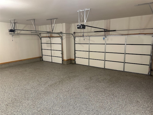 garage featuring baseboards and a garage door opener