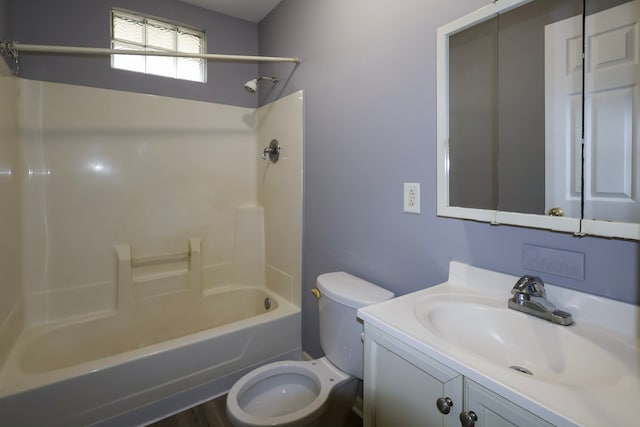 bathroom with bathing tub / shower combination, vanity, and toilet