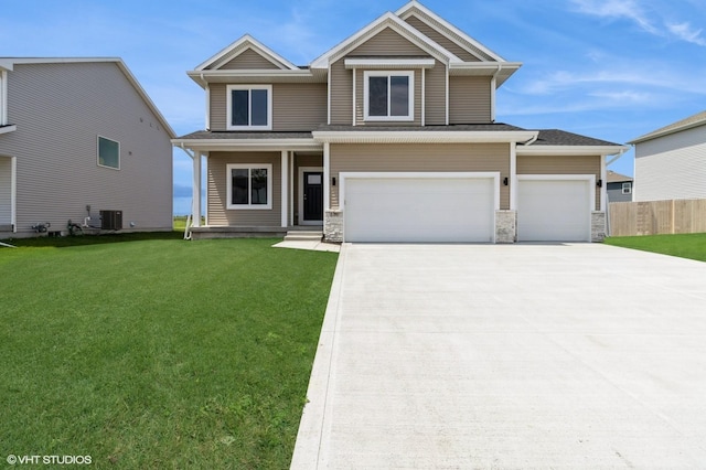 136 Creekside Dr, Bondurant, IA 50035 - view of front of house featuring concrete driveway, stone siding, and an attached garage