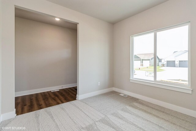 136 Creekside Dr, Bondurant, IA 50035 - carpeted spare room featuring baseboards