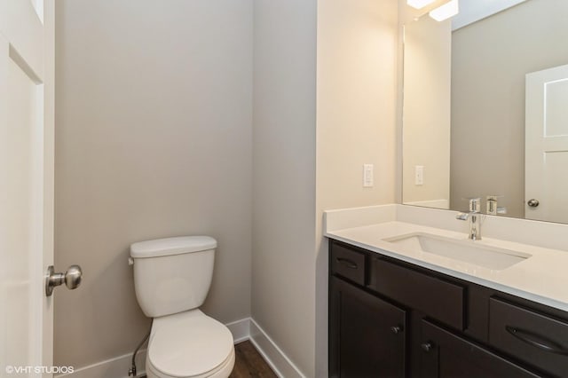136 Creekside Dr, Bondurant, IA 50035 - half bath featuring vanity and wood finished floors