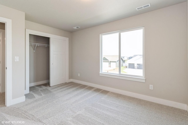 136 Creekside Dr, Bondurant, IA 50035 - unfurnished bedroom with light carpet and a closet