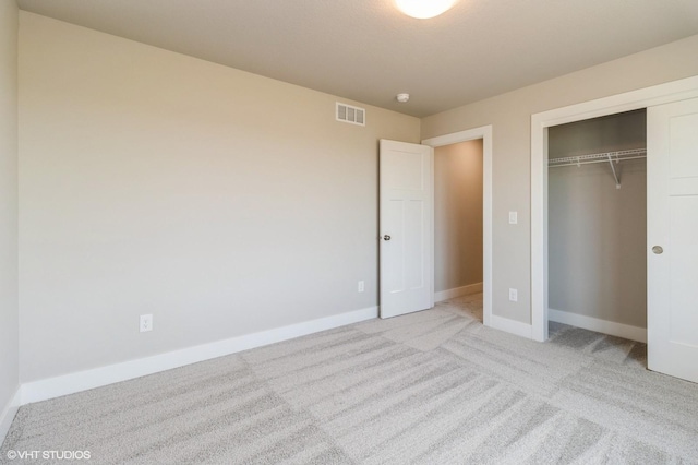 136 Creekside Dr, Bondurant, IA 50035 - unfurnished bedroom featuring a closet and light carpet