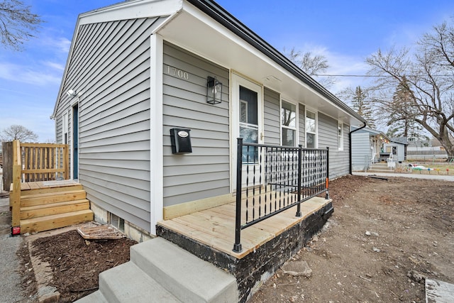 view of side of property with covered porch