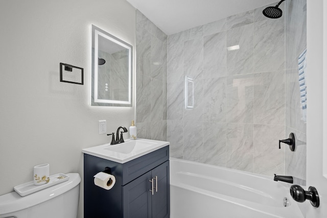 full bathroom with shower / washtub combination, toilet, vanity, and a textured wall