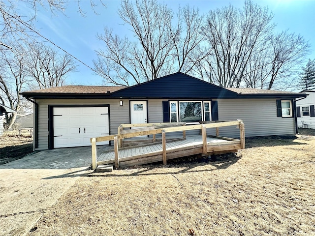 ranch-style house with a deck, driveway, and a garage