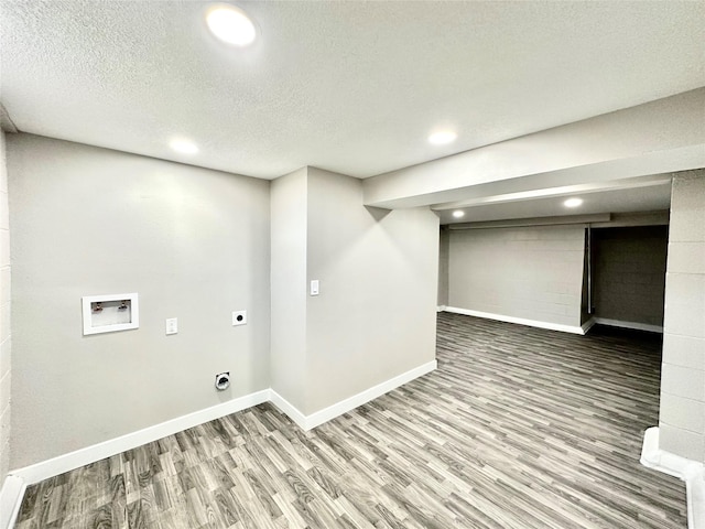 laundry area featuring wood finished floors, baseboards, laundry area, electric dryer hookup, and washer hookup