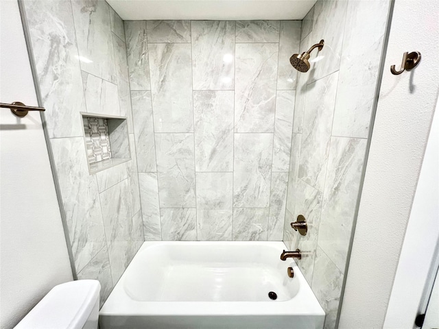 full bathroom with washtub / shower combination and toilet