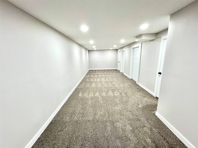 finished below grade area featuring recessed lighting, baseboards, and carpet flooring