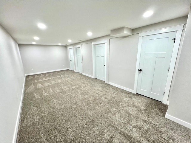 finished basement featuring recessed lighting, carpet, and baseboards