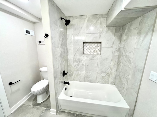 bathroom featuring baseboards, visible vents, toilet, and bathtub / shower combination