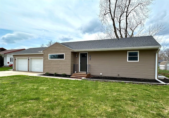 ranch-style house featuring a shingled roof, driveway, a front yard, and a garage
