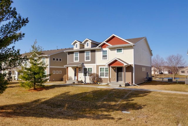 view of front of property featuring a residential view, central AC unit, entry steps, and a front yard