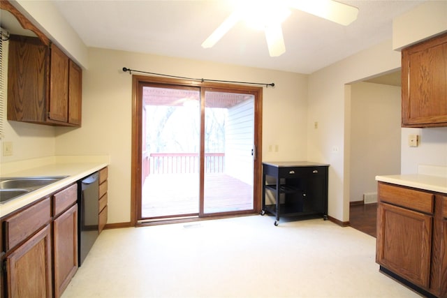 kitchen with baseboards, ceiling fan, light countertops, dishwashing machine, and brown cabinets