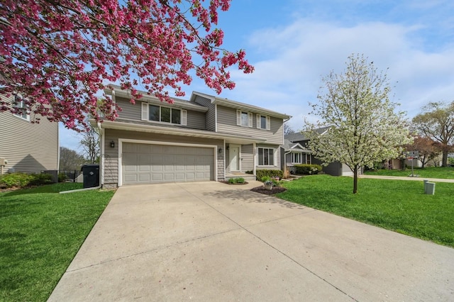 traditional-style house with an attached garage, driveway, and a front yard