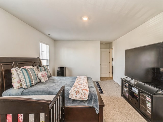 carpeted bedroom with visible vents and baseboards