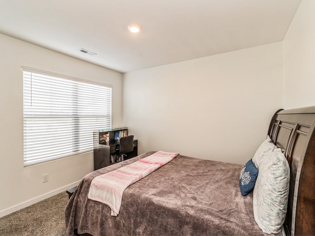 bedroom with visible vents, baseboards, and carpet flooring