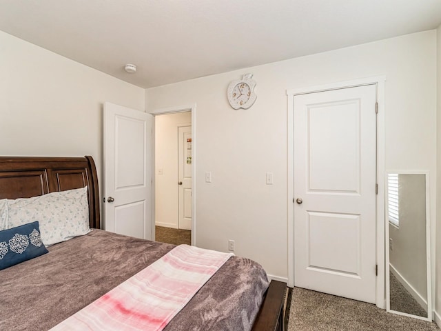 carpeted bedroom with baseboards