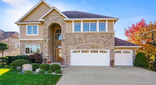 view of front facade featuring a shingled roof, stone siding, and concrete driveway