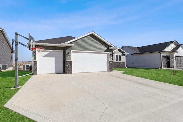 single story home featuring a garage, concrete driveway, stone siding, and a front yard