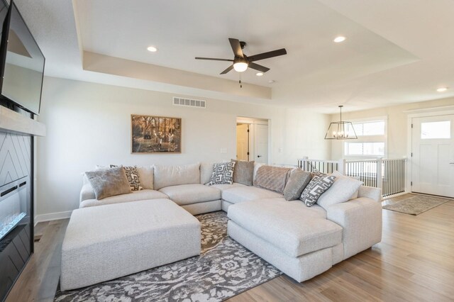 1602 Mulberry St, Granger, IA 50109 - living area with a chandelier, light wood finished floors, ceiling fan, recessed lighting, and a raised ceiling