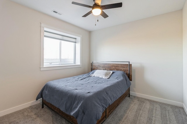 carpeted bedroom featuring baseboards and ceiling fan
