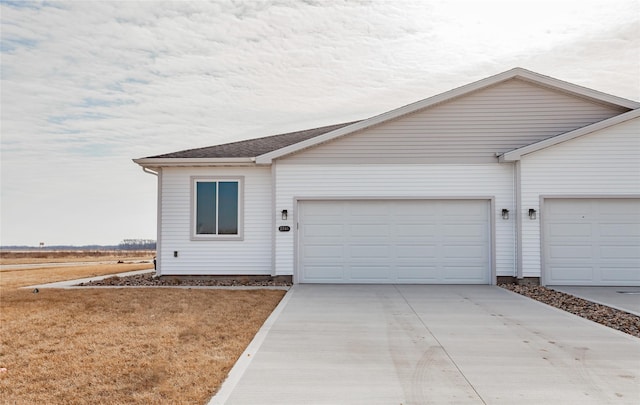 view of front of property featuring an attached garage and driveway