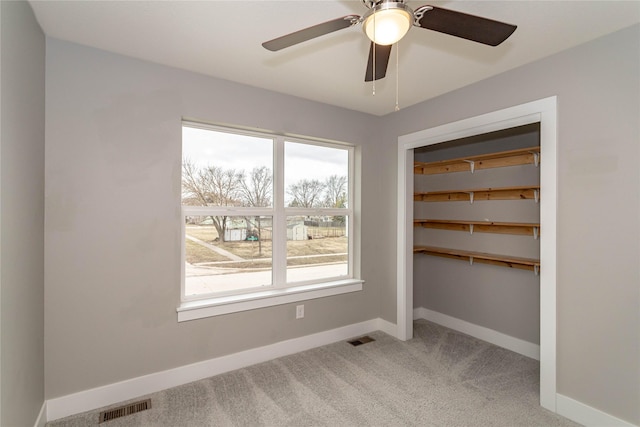 104 Mcpherson St, Boone, IA 50036 - unfurnished room with light carpet and a ceiling fan
