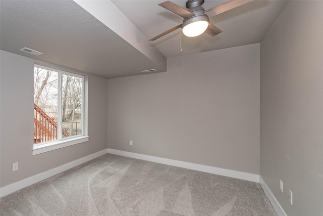 104 Mcpherson St, Boone, IA 50036 - empty room with light colored carpet and a ceiling fan