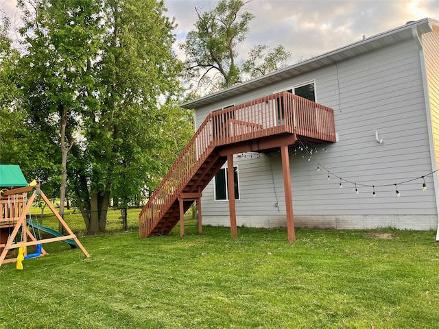104 Mcpherson St, Boone, IA 50036 - rear view of property with stairway, a playground, and a deck