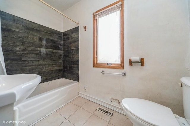 bathroom with tile patterned floors, toilet, visible vents, and shower / washtub combination