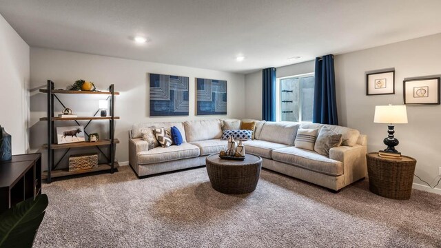 living room with recessed lighting, baseboards, and carpet
