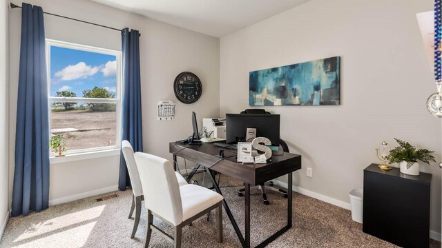 home office with carpet flooring, visible vents, and baseboards