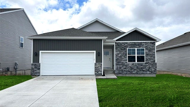 5100 169th St, Urbandale, IA 50322 - view of front of property featuring stone siding, concrete driveway, an attached garage, a front yard, and board and batten siding