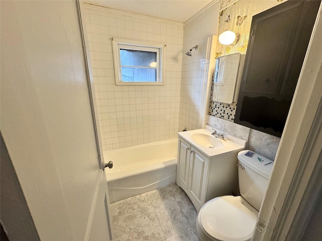 3841 Columbia St, Des Moines, IA 50313 - full bath featuring toilet, vanity, and bathtub / shower combination