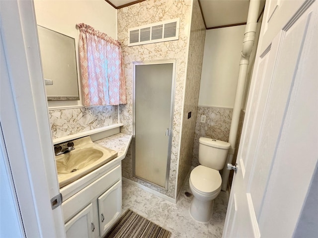 3841 Columbia St, Des Moines, IA 50313 - full bath featuring crown molding, toilet, vanity, a stall shower, and a wainscoted wall