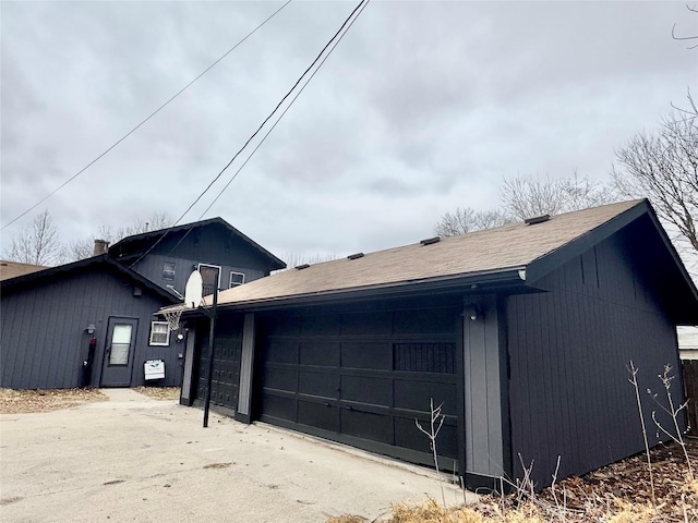 3841 Columbia St, Des Moines, IA 50313 - view of side of home with an attached garage