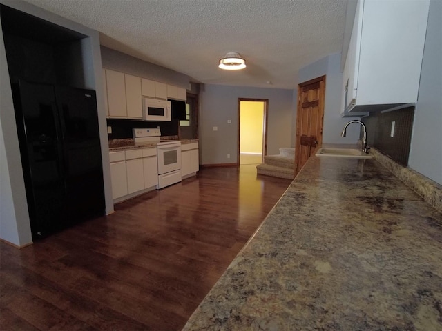1408 Lincoln St, Gowrie, IA 50543 - kitchen featuring white cabinets, dark wood-style flooring, a sink, and white appliances