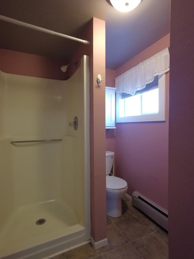 1408 Lincoln St, Gowrie, IA 50543 - bathroom with walk in shower, baseboard heating, tile patterned flooring, and toilet