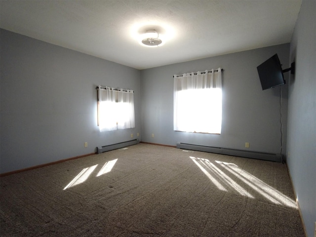 1408 Lincoln St, Gowrie, IA 50543 - carpeted empty room with a baseboard heating unit and baseboards