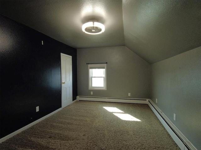 1408 Lincoln St, Gowrie, IA 50543 - additional living space featuring baseboard heating, vaulted ceiling, carpet flooring, and baseboards