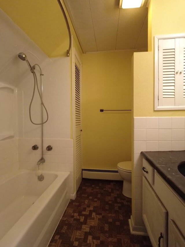 1408 Lincoln St, Gowrie, IA 50543 - bathroom featuring toilet, tile walls, shower / bath combination, vanity, and a baseboard radiator