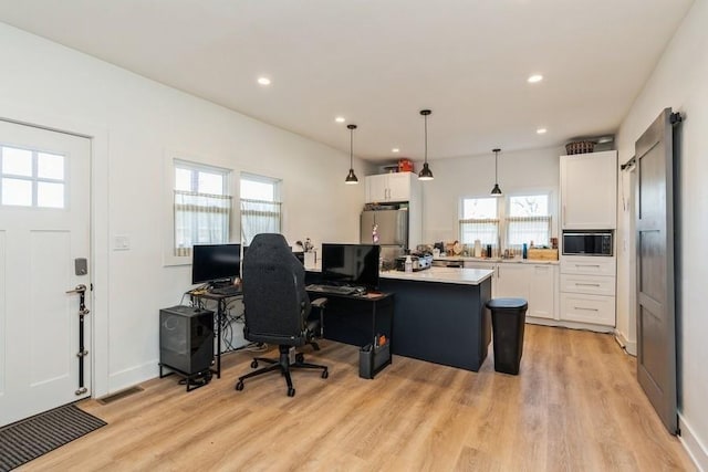 222 W State St, Colfax, IA 50054 - office area with light wood finished floors and recessed lighting
