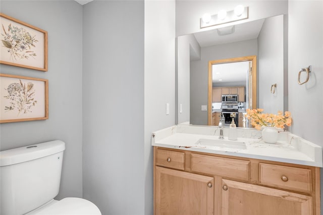 5558 Boston Ct, Johnston, IA 50131 - half bathroom featuring toilet and vanity