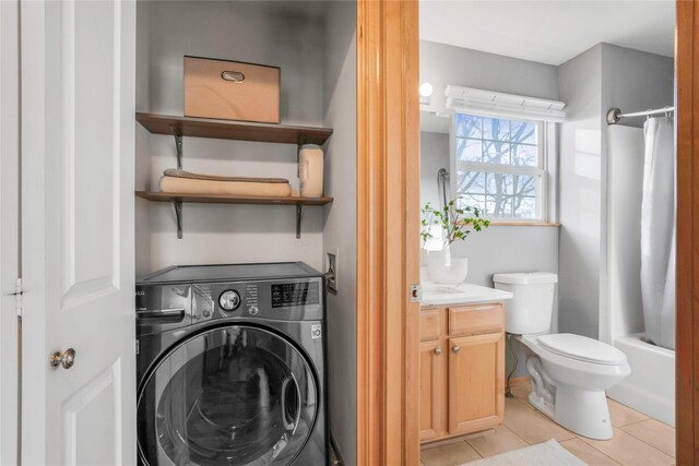 5558 Boston Ct, Johnston, IA 50131 - laundry room featuring washer / clothes dryer and light tile patterned floors