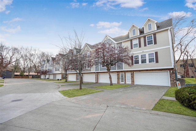 5558 Boston Ct, Johnston, IA 50131 - view of front of property with a residential view, driveway, and a garage