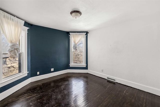 951 24th St, Des Moines, IA 50312 - unfurnished room with wood-type flooring and baseboards