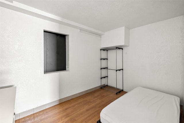 951 24th St, Des Moines, IA 50312 - bedroom with wood finished floors and baseboards