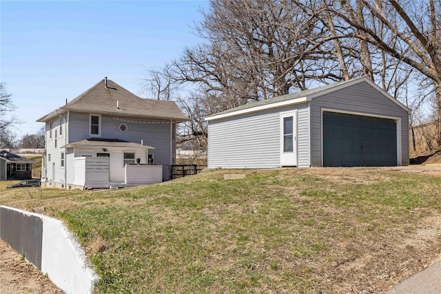 951 24th St, Des Moines, IA 50312 - view of home's exterior with an outbuilding and a detached garage