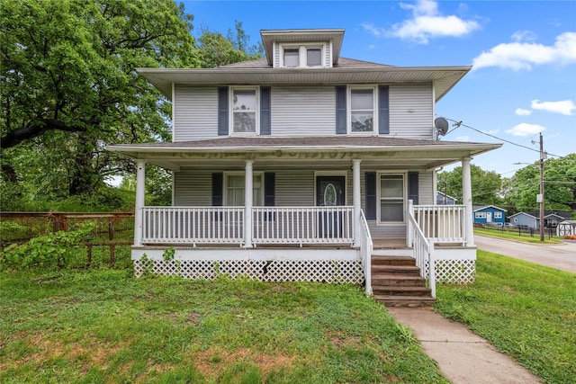 951 24th St, Des Moines, IA 50312 - american foursquare style home with covered porch and a front yard